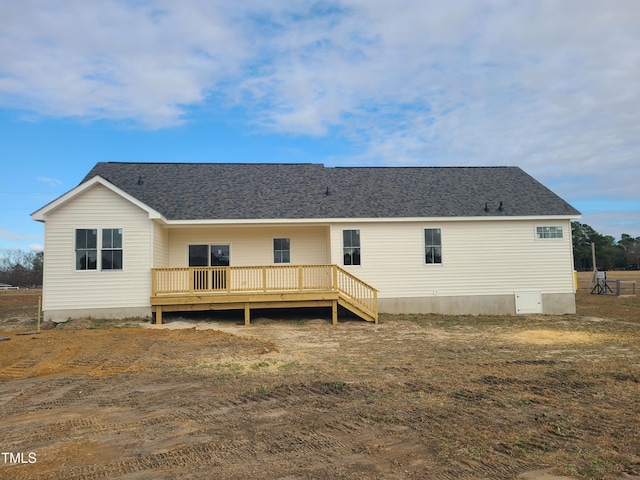 rear view of property with a wooden deck