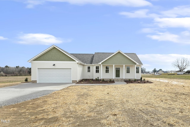 view of front of house featuring an attached garage and driveway