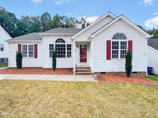 view of front of house featuring cooling unit and a front lawn