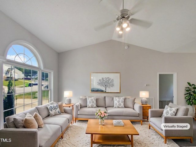 living room featuring lofted ceiling and ceiling fan