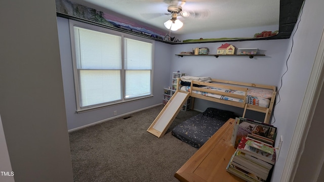 bedroom with baseboards, a ceiling fan, and carpet flooring