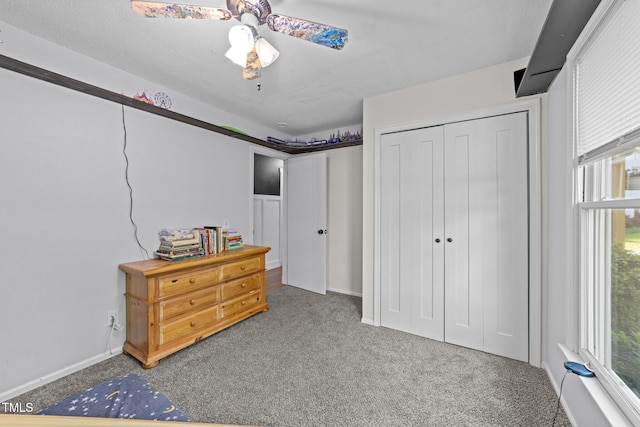 6125 Bellow St, Raleigh, NC 27609 - bedroom with carpet flooring, a closet, ceiling fan, and baseboards