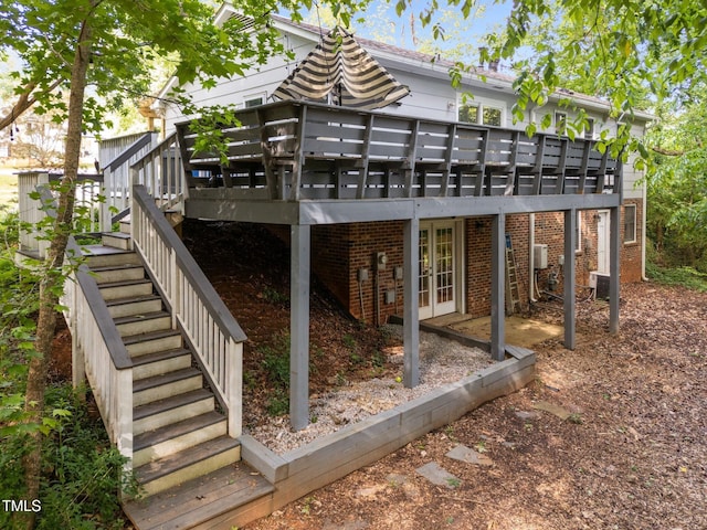 6125 Bellow St, Raleigh, NC 27609 - back of property featuring stairs, french doors, a deck, and central air condition unit