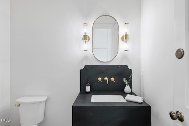 bathroom featuring toilet and sink