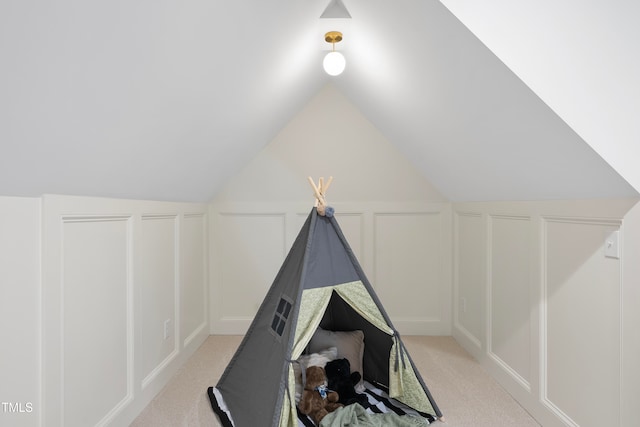 bonus room with light carpet and lofted ceiling