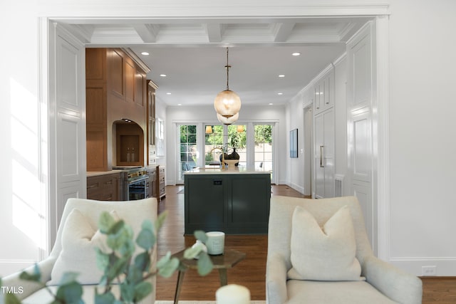 living room featuring beamed ceiling, ornamental molding, dark wood-type flooring, and french doors