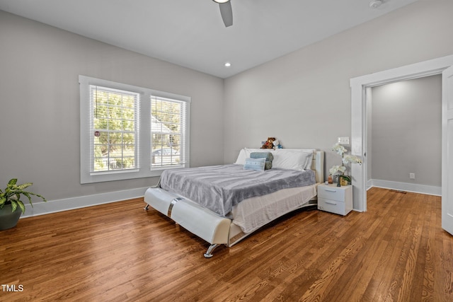 bedroom with wood-type flooring and ceiling fan