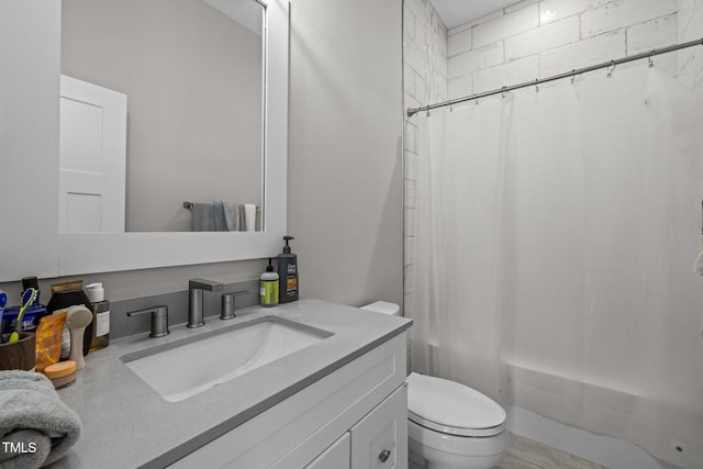 full bathroom with vanity, toilet, and shower / bath combo