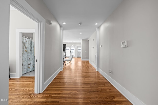 hall with wood-type flooring