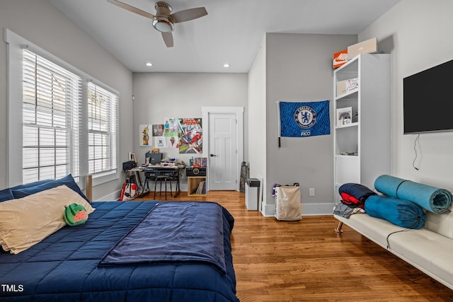 bedroom featuring ceiling fan and hardwood / wood-style floors