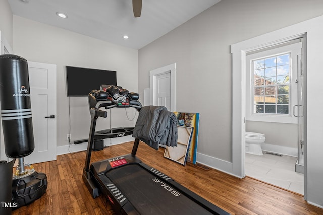 workout area with hardwood / wood-style floors and ceiling fan