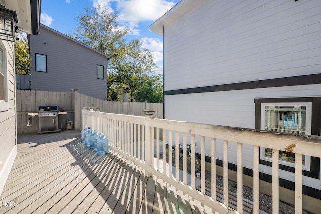 wooden terrace with area for grilling