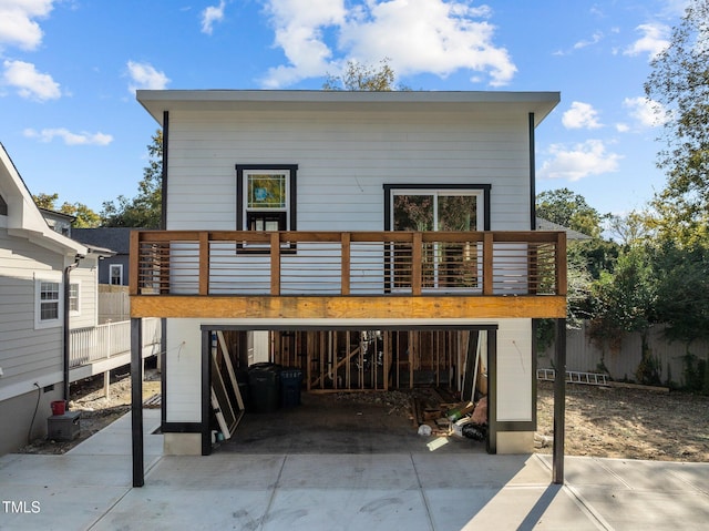 back of property with a balcony