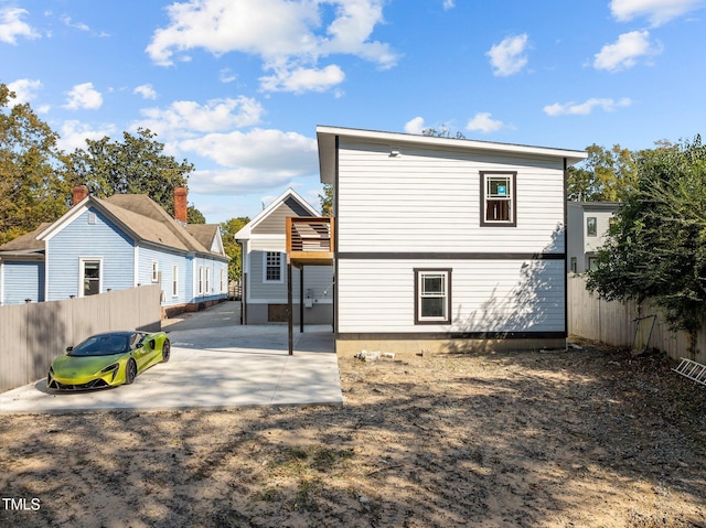 back of property featuring a patio