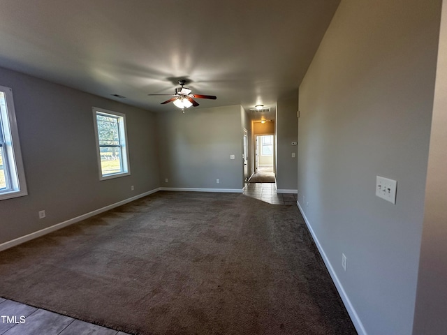 carpeted empty room with ceiling fan