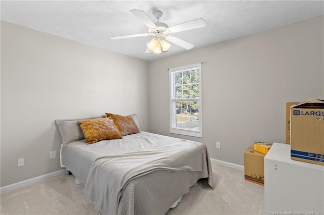 bedroom with light carpet and ceiling fan