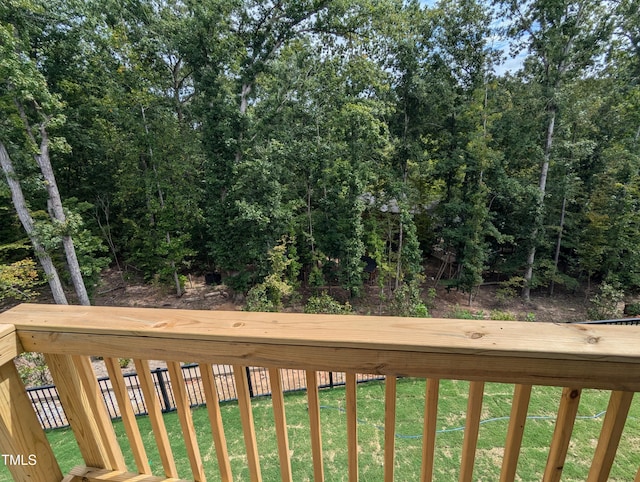 wooden terrace featuring a yard