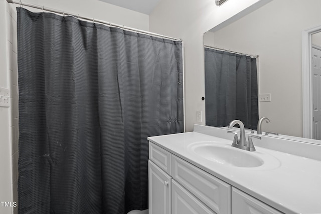 bathroom with vanity and a shower with curtain