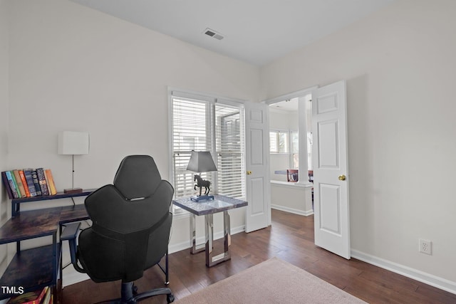 office space with dark hardwood / wood-style flooring