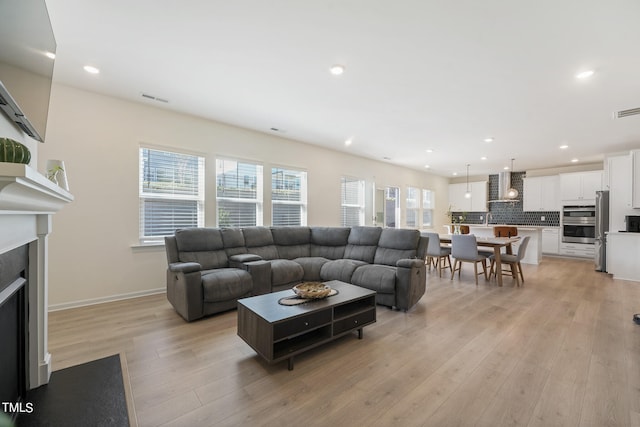 living room with light hardwood / wood-style floors