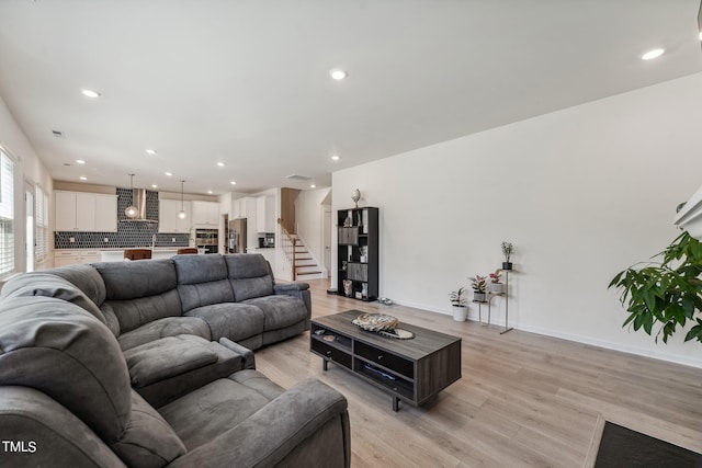 living room with light hardwood / wood-style floors