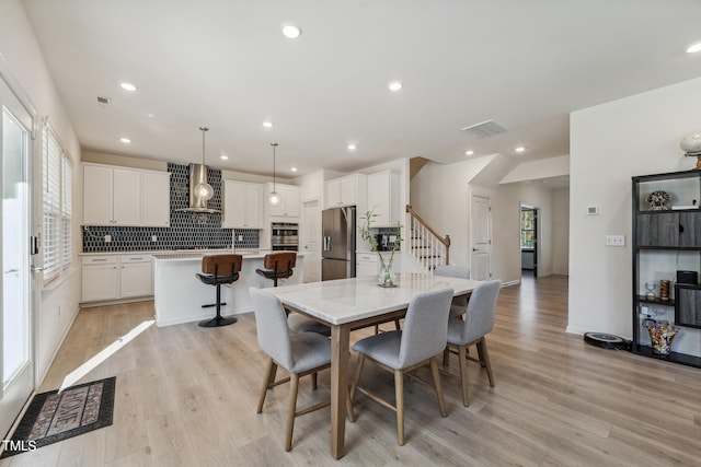 dining area featuring light hardwood / wood-style flooring