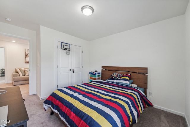 carpeted bedroom with a closet