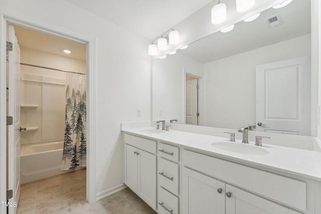 bathroom with vanity, tile patterned floors, and shower / tub combo