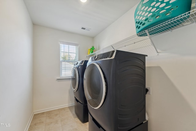 laundry room featuring independent washer and dryer