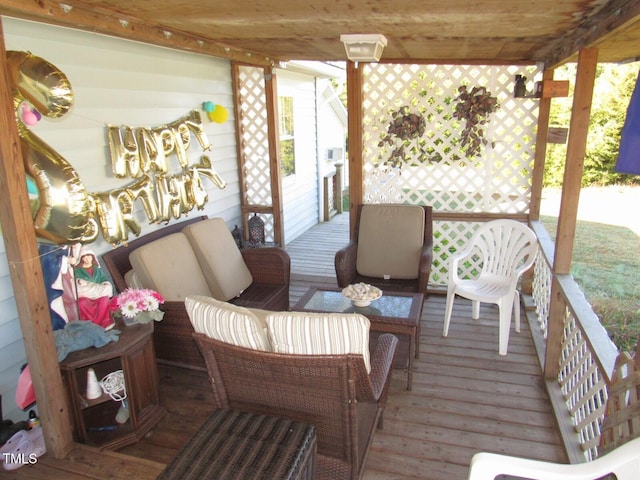 wooden terrace with outdoor lounge area