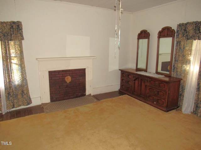 unfurnished living room with crown molding and carpet floors