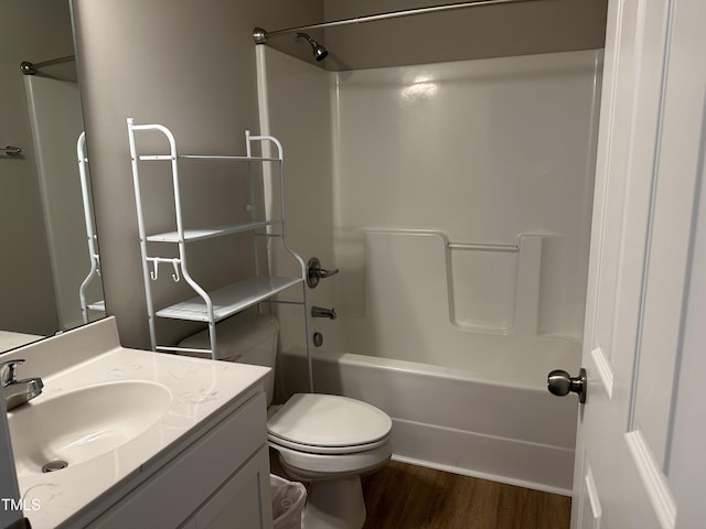 full bathroom featuring vanity, hardwood / wood-style floors, toilet, and shower / bath combination