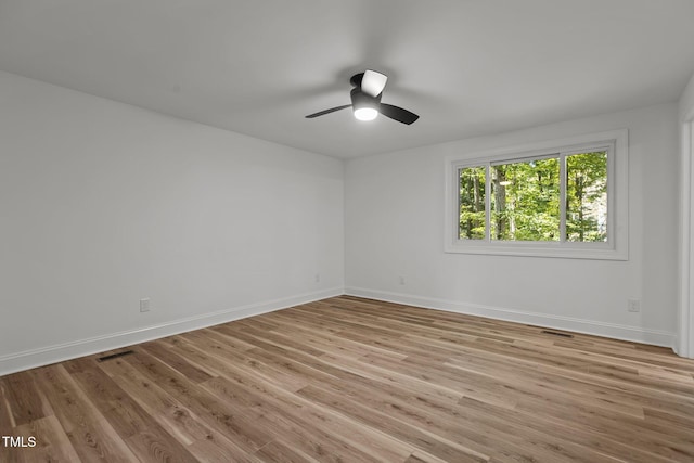 unfurnished room featuring light hardwood / wood-style floors and ceiling fan