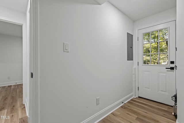 entryway with electric panel and light hardwood / wood-style floors