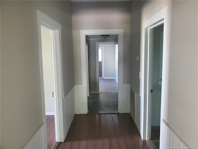 hallway with dark wood-type flooring