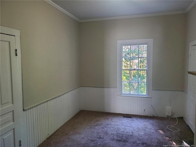 spare room with carpet and ornamental molding