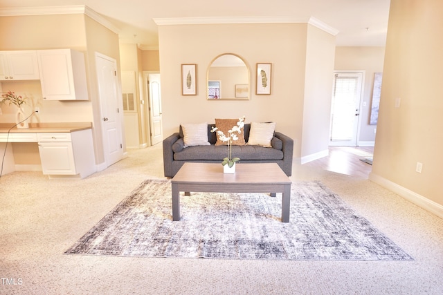 living room with built in desk, ornamental molding, and light carpet