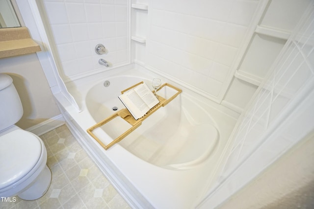 bathroom with shower / tub combination and toilet