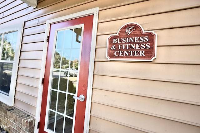 view of exterior entry featuring a garage