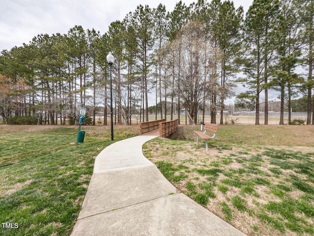 view of property's community featuring a lawn