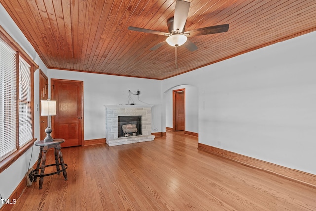 435 Tant Rd, Zebulon, NC 27597 - unfurnished living room featuring a fireplace, a ceiling fan, wooden ceiling, baseboards, and crown molding