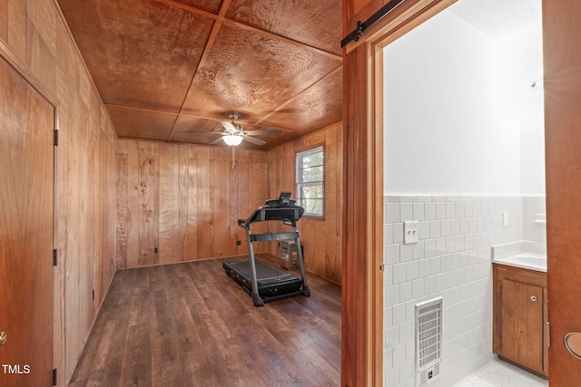 435 Tant Rd, Zebulon, NC 27597 - exercise area with wood finished floors, a ceiling fan, wood walls, and tile walls