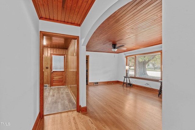 435 Tant Rd, Zebulon, NC 27597 - additional living space featuring wooden ceiling, arched walkways, a ceiling fan, light wood-style floors, and baseboards