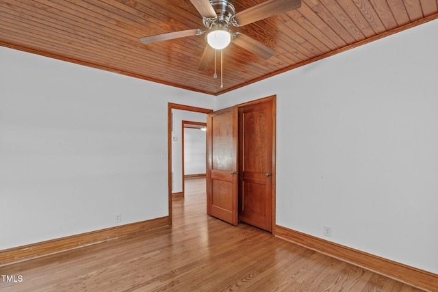 435 Tant Rd, Zebulon, NC 27597 - spare room featuring crown molding, baseboards, ceiling fan, light wood-type flooring, and wood ceiling