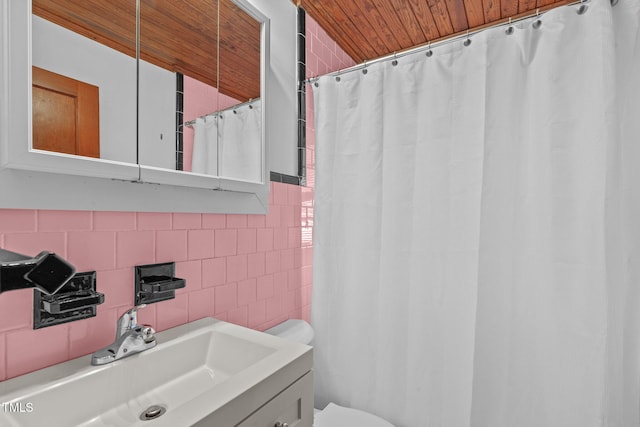 435 Tant Rd, Zebulon, NC 27597 - bathroom featuring tile walls, wooden ceiling, toilet, vanity, and a shower with shower curtain