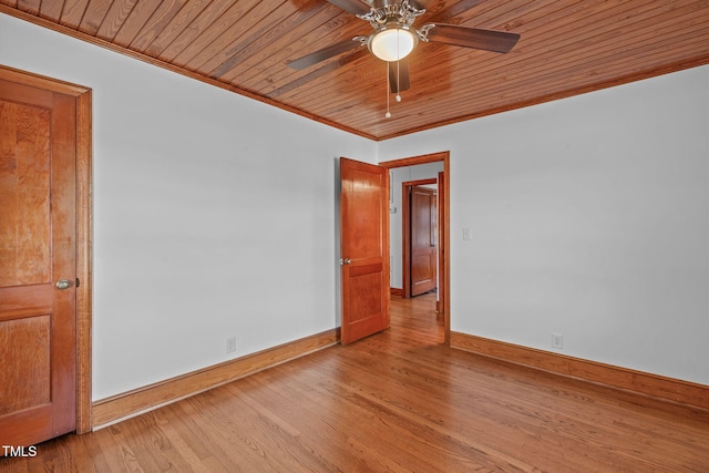 435 Tant Rd, Zebulon, NC 27597 - spare room featuring crown molding, baseboards, light wood-type flooring, ceiling fan, and wood ceiling