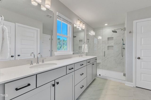 bathroom featuring vanity and an enclosed shower