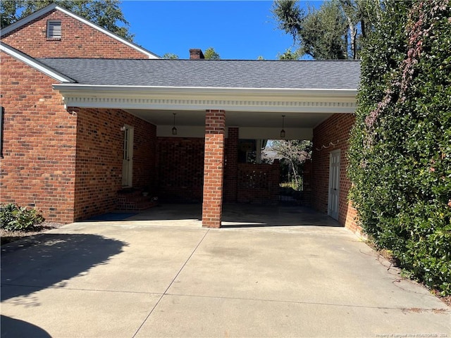 view of vehicle parking featuring a carport