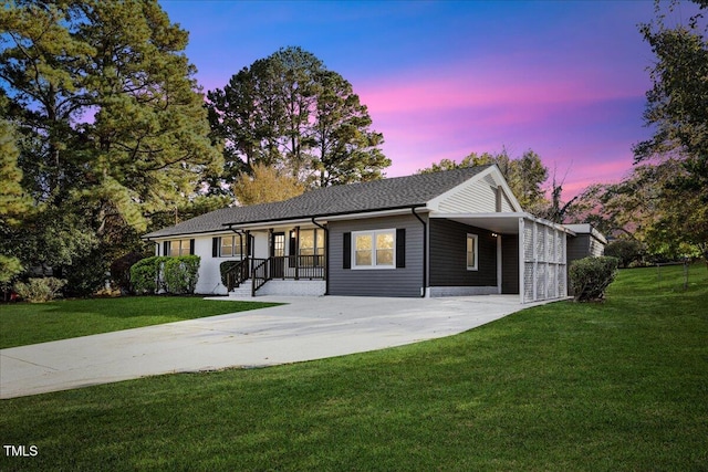 single story home featuring a yard and a porch