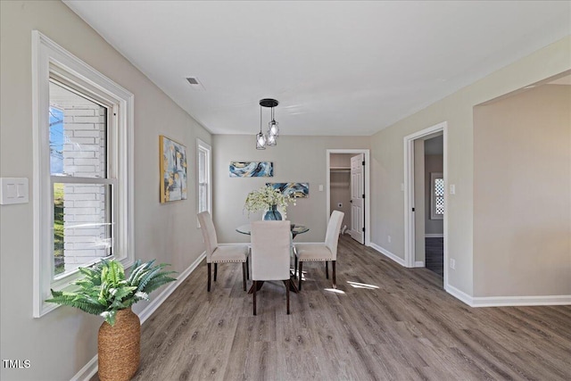 dining area with hardwood / wood-style flooring